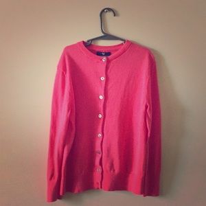 A pink Gap cardigan